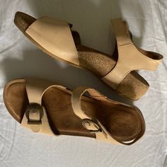 Size 40 (9-9.5), Very Minimal Wear. Comfortable Cream Sandals With Velcro Buckle Detail. Footbed Is Cork, Same As The Trulie And My Dear Sandal. Comfortable Ankle Strap Sandals With Heel Loop, Casual Beige Sandals With Heel Loop, Taos Sandals, Casual Beige Leather T-strap Sandals, Leather T-strap Sandals With Removable Insole And Toe Loop, Cheap Leather T-strap Sandals With Removable Insole, Beige T-strap Sandals With Removable Insole, Brown Adjustable T-strap Sandals With Cushioned Footbed, Cream Sandals