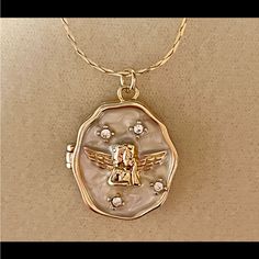 New Charming Enamel & Cubic Zirconia Angel/Cupid Locket Pendant Necklace. Chain Is 17 Inches Long With A 2 Inch Extension. Locket Is 3/4 Inch Long & 1/2 An Inch Wide. Angel Cupid, Locket Pendant Necklace, Necklace Chain, Locket, Womens Jewelry Necklace, 4 Inch, Cubic Zirconia, Jewelry Necklaces, Women Jewelry