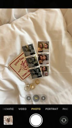 an image of some pictures on a bed with white sheets and buttons in the foreground