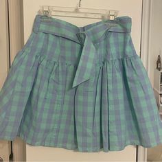 Never Worn. Blue And Green Gingham With Adjustable Belt Preppy Blue Bottoms For Spring, Preppy Blue Skort For Spring, Preppy Blue Bottoms For Day Out, Blue Preppy Skort For Spring, Green Preppy Mini Skirt For Summer, Preppy Blue Skirt For Spring, Preppy Green Skirt For Spring, Preppy Blue Skirt For Summer, Preppy Blue Summer Skirt