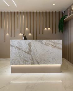 a white marble reception counter in a lobby