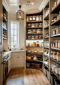 a kitchen with lots of shelves filled with food