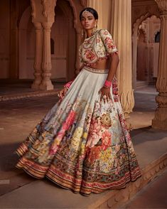 Featuring an elegant interplay of exquisite floral motifs with intricate hand embroidery on the lehenga. It is paired with a meticulously embroidered blouse with intricate thread and hand beadwork on yoke and sleeves and styled with a co-ordinated dupatta. Note: Potli is for styling purposes only Floral Lehenga, Floral Motifs, Embroidered Blouse, Raw Silk, Floral Motif, Modern Woman, Lehenga, Bead Work, Hand Embroidery