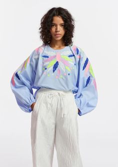 Top is cut from a crisp cotton-poplin decorated with colorful embroideries. the style is detailed with voluminous sleeves that fall to elasticated cuffs and a round neckline.    - 100% cotton  - lightweight non-stretchy fabric  - intended for an oversized fit  - hidden zip fastening at the back  - voluminous sleeves with elasticated cuffs  - embroidery details  - light blue/dark blue/lime green    fabric    100% cotton  embroidery: 100% polyester    washing instructions    machine washable Upcycle Clothes Diy, Embroidery Top, Cotton Embroidery, Engineered Garments, Embroidery Details, Green Fabric, Blue Dark, Upcycle Clothes, Designer Outfits Woman