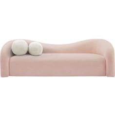 a pink couch with two white balls on it's back and the seat up