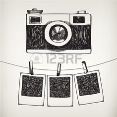 an old camera hanging on a clothes line with three pictures attached to it stock photo