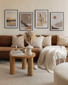 a living room filled with lots of furniture and pictures on the wall above it's coffee table