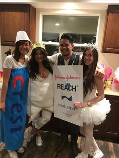 three people in costumes pose for a photo while holding a sign that reads reach cool mix