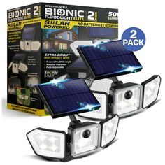 two solar powered lights are shown in front of a box