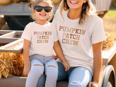 These super-soft, lightweight Pumpkin Patch Crew Shirts are perfect for fall days at the pumpkin patch and group family photos. Please check the size charts for the perfect fit! Details: ✔ Solid colors: 100% cotton. ✔ Heather colors: Cotton polyester blend. ✔ Lightweight fabric. ✔ Premium DTG prints - no peeling or cracking. ✔ Easy care: Machine washable, maintains shape and color. 🗓️ Current Production Time: 2-5 business days. All Marin Studios products are lovingly designed in my studio in Ma Casual Family T-shirt For Fall, Fall Family Matching Crew Neck Tops, White T-shirt For Fall Family Matching, Fall Tops With Letter Print, Family Letter Print Tops For Fall, Family Matching Short Sleeve Tops For Fall, Fun Custom Print Tops For Fall, Mommy And Me Shirts, Family Matching Shirts