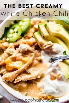 the best creamy white chicken chili recipe in a bowl with avocado and cucumbers