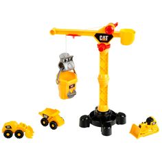 a yellow toy crane with construction vehicles around it