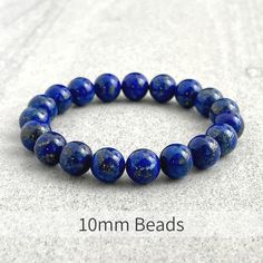 Men's beaded bracelet features: ~ 6mm, 8mm or 10mm lapis lazuli beads ~ 6mm, 8mm or 10mm onyx beads ~ 6mm, 8mm or 10mm hematite beads ~ Stretchy cord; simply slide bracelet on and off wrist ~ Comes packaged in a re-usable micro fibre pouch To ensure the perfect fit, please use the bracelet sizing instructions found in the photo gallery. Adjustable Lapis Lazuli Stretch Bracelet With Round Beads, Lapis Lazuli Beaded Bracelets With Polished Round Beads, Lapis Lazuli Beaded Bracelets With Gemstone, Polished Beads Lapis Lazuli Round Bracelets, Round Lapis Lazuli Bracelets With Polished Beads, Polished Beads Lapis Lazuli Bracelets, Lapis Lazuli Gemstone Beaded Bracelets, Adjustable Lapis Lazuli Bracelet With 8mm Beads, Blue Lapis Lazuli Beaded Bracelets