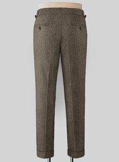 Present your effortless sense of style in these timeless Vintage Dark Brown Herringbone Highland Tweed Trousers. Crafted from pure wool, the trousers once stepped into the limelight are sure to cement their timeless and classic status. 
 
 Look Includes  Vintage Dark Brown Herringbone Tweed Fabric  Cross Pocket  Forward 2 Pleats  Side Tabs (No Loops)- Arrow Shape  Bottom Cuff (1.5")  Two Welted Back Pockets on Trousers   
 You can change the look during customization if required. 
 
 Lining: Vis Classic Tweed Bottoms For Fall, Formal Tweed Pants With Herringbone Pattern, Classic Tweed Pants For Work, Classic Tweed Pants For Business Casual, Classic Pants With Herringbone Pattern For Tailoring, Classic Tailored Bottoms With Herringbone Pattern, Classic Bottoms With Herringbone Pattern, Elegant Fitted Tweed Bottoms, Classic Tweed Trousers