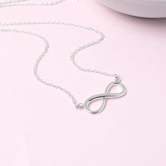 Sterling silver infinity necklace.  This necklace is a perfect way to symbolise unbreakable bonds of love and friendship. The polished infinity is set on a simple sterling silver trace chain which is available in 3 lengths. It comes beautifully presented in a foil printed gift box tied with ribbon. THE DETAILS: * Sterling silver infinity - 22mm * Sterling silver trace chain * Handmade in the UK * Beautifully gift boxed Silver Infinity Necklace, Infinity Necklace Silver, Love And Friendship, Infinity Necklace, Pretty Bracelets, Necklace Sterling Silver, Foil Print, Print Gifts, Infinity Bracelet