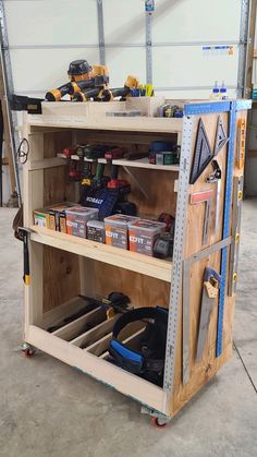 a workbench with tools and construction equipment on it's shelves in a garage