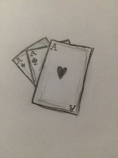 two playing cards with a heart drawn on them