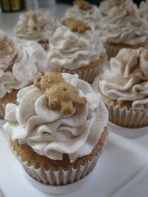 several cupcakes with white frosting and sprinkles