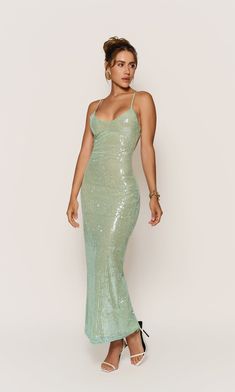 Ice green Sequin Stretch Fabric Fully lined Maxi dress Back slit Invisible back zipper Dry clean only Designed in USA Model wears a size Small Model is 5'8” and weights 130 Lbs. Sequin Maxi Dresses, Rave Diy, Mermaid Board, Glitter Party Dress, Green Evening Gowns, Green Sequin Dress, Wet Dress, Prom Dress Inspo, 130 Lbs