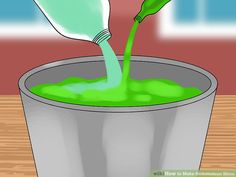 a green liquid being poured into a bucket