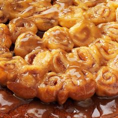 cinnamon rolls are covered in caramel sauce