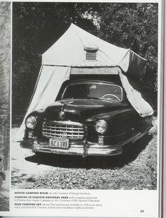 an old black and white photo of a car with a tent on top