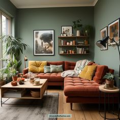 a living room filled with lots of furniture and plants on the wall next to a window