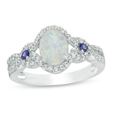 Set a sophisticated tone with this glamorous fashion ring. Crafted in sterling silver, this enchanting style showcases a 5.0 x 3.0mm oval-shaped lab-created iridescent opal cabochon flanked by 2.0mm lab-created bright blue sapphires. Ribbons lined with shimmering lab-created white sapphires artfully wrap each stone and continue along the split shank. Buffed to a brilliant luster, this comfort-fit choice sparkles with exquisite design. This ring is available in size 7 only. Sterling silver rings Unique Opal Ring, Engagement Ring Necklace, Disney Fine Jewelry, Glamorous Fashion, Unique Opal, Open Frame, Bling Rings, Split Shank, Fashion Ring