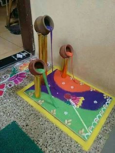 two vases sitting on top of a colorful rug