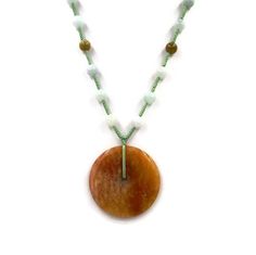 "Chinese Orange Jade Donut Amulet Necklace - Orange Donut Amulet Necklace - Jade Beads Good Luck Amulet Necklace on green hand-knotted silk cord.30\" long with 2.5\" pendant drop. very good to excellent condition. Free Domestic Shipping VISIT OUR NEW Etsy Shop---> DecoDivaJewelryShop <--- For Handcrafted Heirloom Quality Antique and Art Deco Collectible Originals & Reproductions with Vintage Gemstones! https://www.etsy.com/shop/DecoDivaJewelryShop **International shipping is NOT FREE u Spiritual Jade Beaded Pendant Necklace, Spiritual Jade Crystal Necklaces With Round Shape, Spiritual Beaded Chain Necklace With Round Pendant, Spiritual Necklace With Beaded Chain And Round Pendant, Jade Necklace With Round Gemstone Beads, Bohemian Round Jade Jewelry, Jade Amulet Necklace With Round Pendant, Spiritual Jade Round Pendant Necklace, Handmade Round Jade Beads