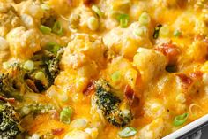 a casserole dish with broccoli, cauliflower and cheese