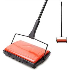 a red and black floor sweeper sitting on top of a white surface next to a cleaning brush