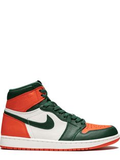 the air jordan 1 mid is an orange and green sneaker with white uppers