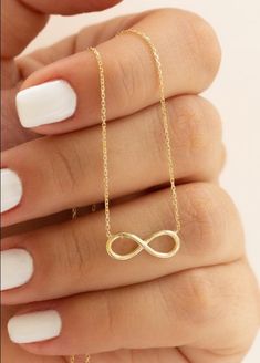 "✦ 𝐈𝐭𝐞𝐦 𝐃𝐞𝐬𝐜𝐫𝐢𝐩𝐭𝐢𝐨𝐧 \"Embrace eternal love with our Infinity Necklace from Pashicreations. This dainty piece, plated in luxurious 14k gold, features a timeless infinity symbol, perfect for symbolizing everlasting affection. A thoughtful gift for your girlfriend, mother, sister, or any special woman in your life, whether for Mother's Day, anniversaries, birthdays, or just to express your love. Radiate elegance and sentimentality with this exquisite piece, ideal for adding a touch of sophistication to any outfit. Shop now for a meaningful gift that will be cherished for a lifetime.\" ✦ Product Details:- Material : 925 Sterling Silver Finish : 14k Gold Plated  ✦Gifting options 🎁 We can also add your personalized messages to both standard and gift wrapping. ✦ 𝐁𝐮𝐲𝐞𝐫𝐬 𝐍𝐨? Infinity Necklace Gold, Eternity Necklace, Pretty Jewelry Necklaces, Gold Chain Design, Necklace For Girlfriend, Gold Locket, Infinity Necklace, Classy Jewelry, Gifts For Your Girlfriend