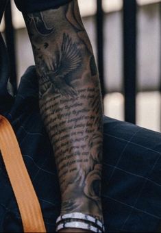 a man with a tattoo on his arm