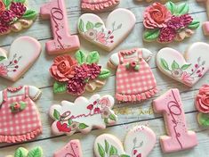 decorated cookies are arranged on a table