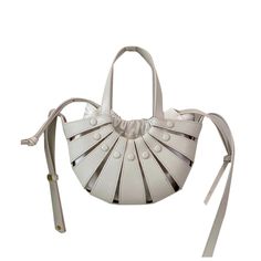 SIANA Cut Out Leather Tote Bag - ithelabel.com Trendy White Evening Bucket Bag, White Leather Bucket Bag With Phone Pocket, White Evening Bucket Bag With Top Handle, White Leather Bucket Bag With Phone Holder, White Leather Bucket Bag With Phone Slot, Leather Shoulder Bag With Mobile Phone Pocket For Spring, White Leather Bucket Bag For Spring, Summer White Leather Bucket Bag, White Leather Bucket Bag For Summer