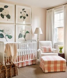 a baby's room with pictures on the wall and a crib in front