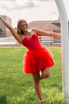 Effortlessly elegant and eye-catching, this black A-line homecoming dress features a strapless design and tiered tulle layers for a stunning silhouette. Perfect for any special occasion, this dress will make you feel confident and beautiful with every step you take. Prom Tutu Dress With Sweetheart Neckline, Tulle Tutu Dress With Sweetheart Neckline For Prom, Fitted Strapless Tulle Dress For Prom Season, Party Tutu Dress With Sweetheart Neckline, Party Strapless Dress With Tulle Skirt, Tulle Mini Dress For Homecoming And Prom Season, Flirty Tulle Mini Dress For Homecoming, Sweetheart Neckline Tutu Dress For Party, Strapless Tulle Dress With Fitted Bodice For Homecoming