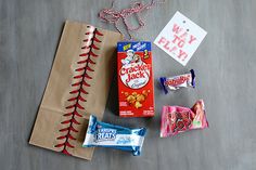 candy, crackers, and other items are laid out on the floor next to each other