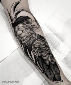 a black and white tattoo with a bird on it