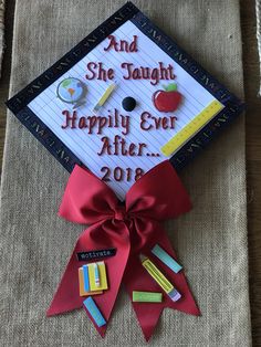 a graduation cap with the words and she taught happily ever after 2013