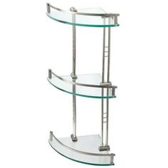 three tiered glass shelf with metal bars on the bottom and shelves below it, against a white background