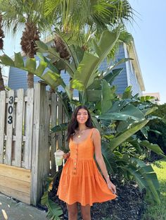 Our Orange You Glad Mini Dress is the cutest casual dress to add to your wardrobe! This dress features front buttons, scoop neckline, adjustable straps and tiered style. Pair this dress with your favorite sandals or sneakers for the perfect weekend outfit! Content: 50% Cotton 50% Rayon Fit: TTS Model wearing size: Small Model sizing: 0-2 top, 24" bottoms | Height: 5'3" Orange Dress Casual, Orange Sun Dress, Dance Team Photos, Orange Summer Dress, Orange Sundress, Orange Dress Summer, Cute Casual Dresses, Orange You Glad, Dance Team