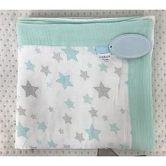 a baby blanket with stars on it and a tag attached to the back of it