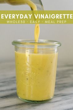 a person pouring mustard into a jar with the words everyday vinaigrette whole 30 easy meal prep