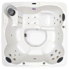 the hot tub is white and has black trimmings on the sides, with four jets