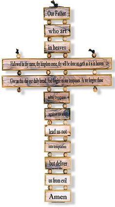 a wooden cross that has some words on it