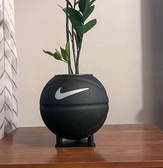 a vase with flowers in it sitting on a table