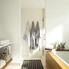 a bathroom with towels hanging on the wall